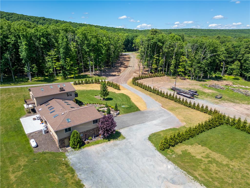 374 Packer Drive Weatherly, PA 18255 - Photo 6 of 30 Perched on a verdant hillside, this property offers serene privacy and expansive outdoor living amidst mature trees.