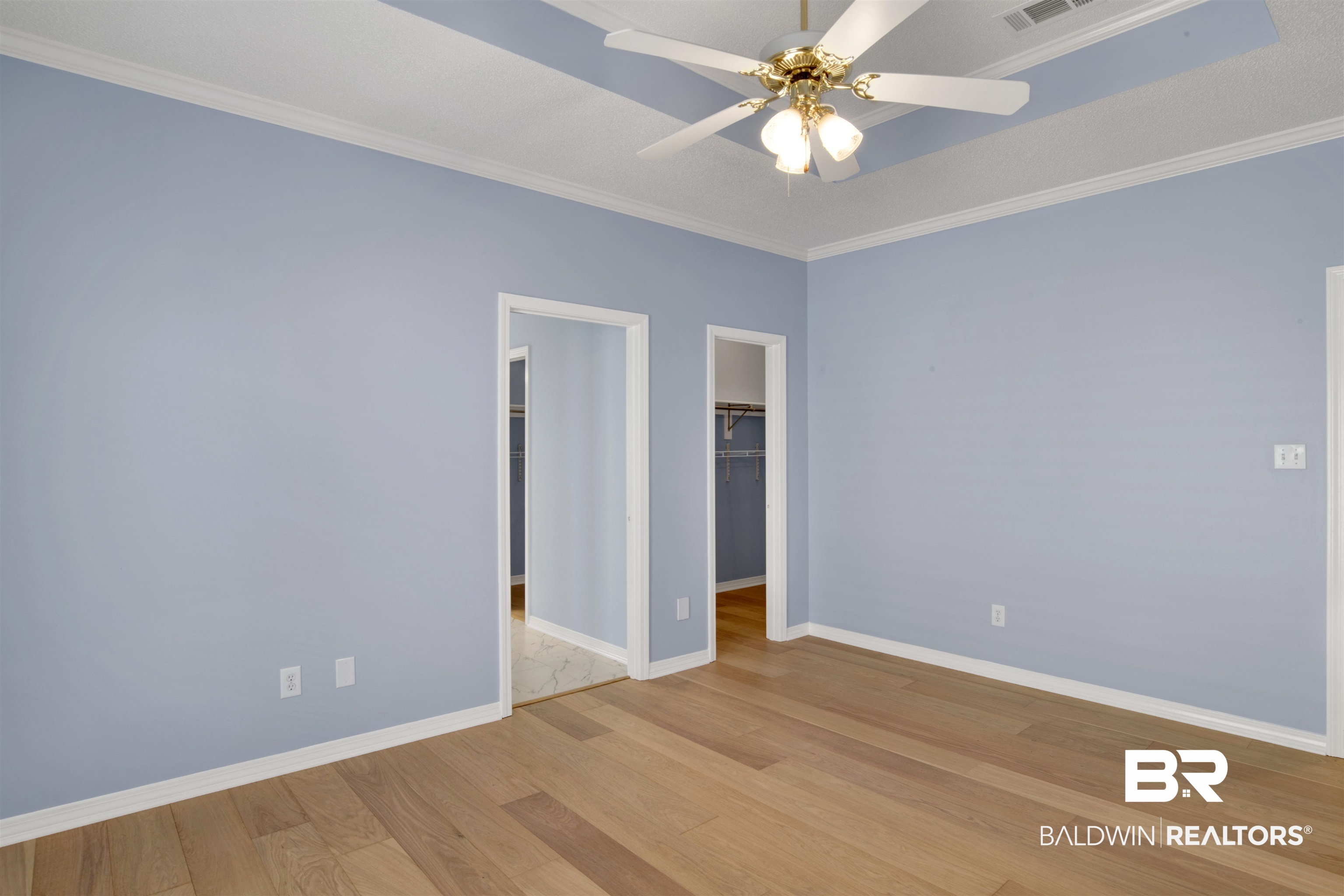 125 Woodruff Court Mobile, AL 36608 - Photo 16 of 27 Primary bedroom featuring crown molding, light wood-type flooring, and ceiling fan