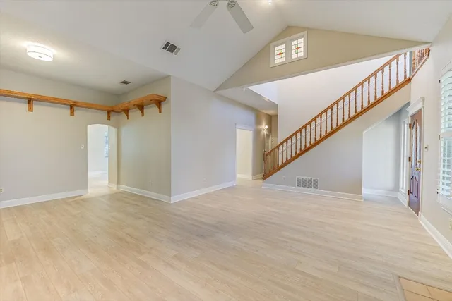a view of a dining room with furniture and a book shelf