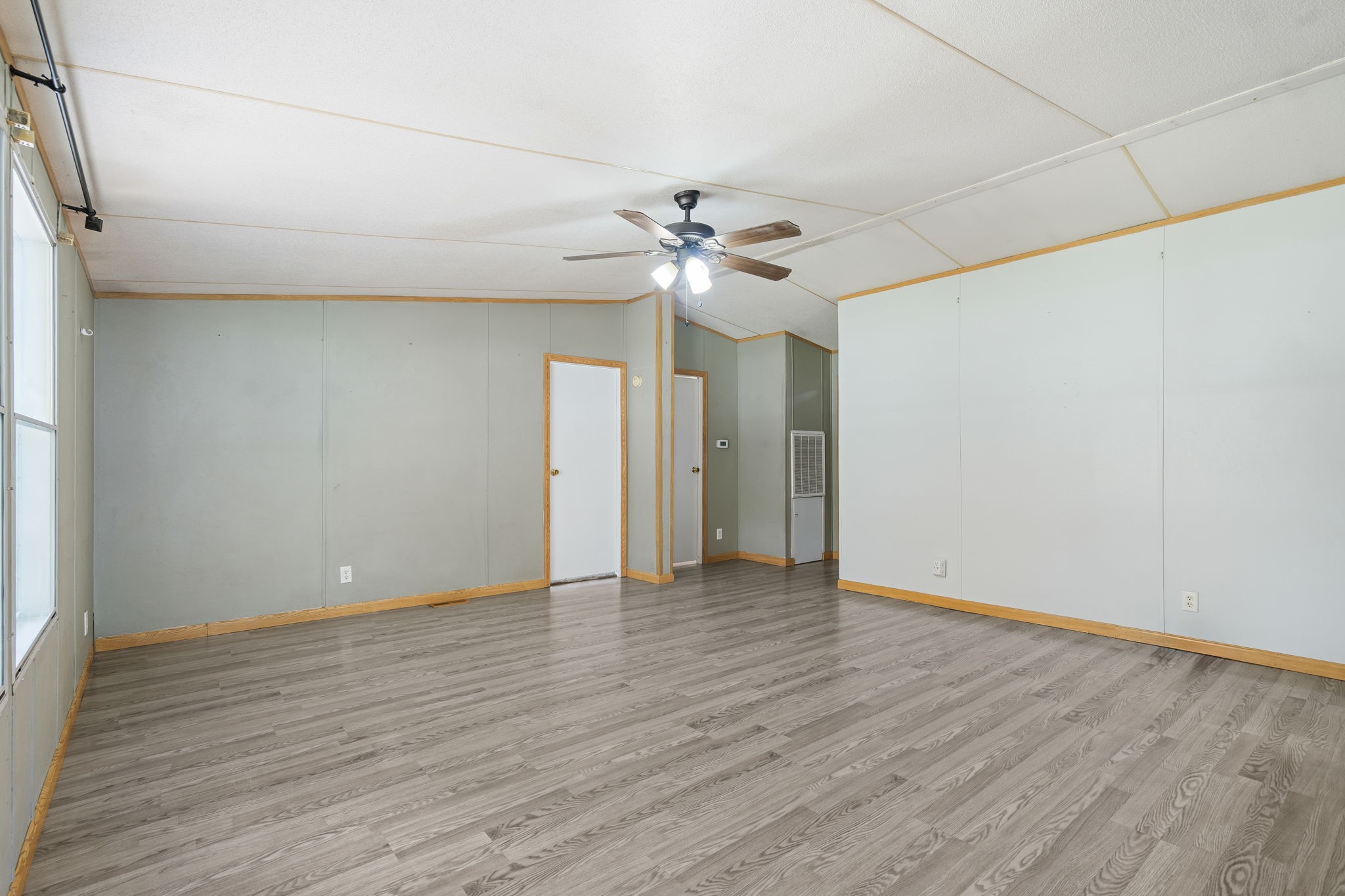 25003 Joseph Road Hockley, TX 77447 - Photo 12 of 47 a view of an empty room with a window and wooden floor