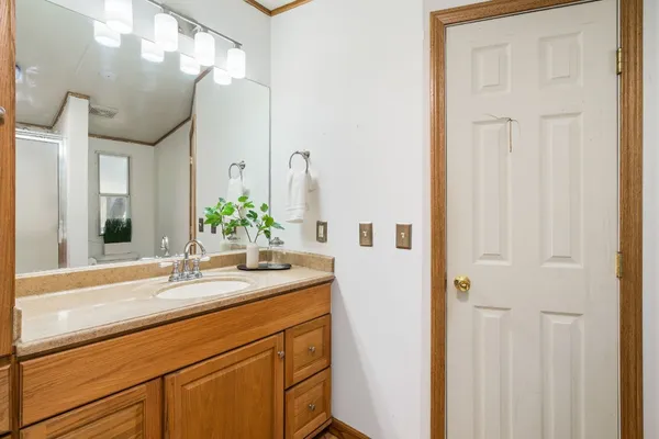a bathroom with a sink and a mirror