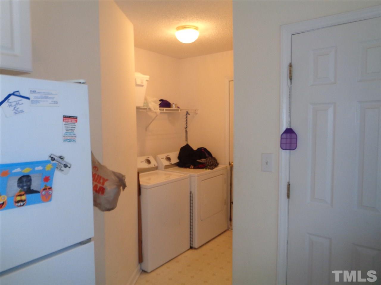 7124 Spanglers Spring Way Raleigh, NC 27610 - Photo 3 of 10 a bathroom with a sink a toilet and a shower