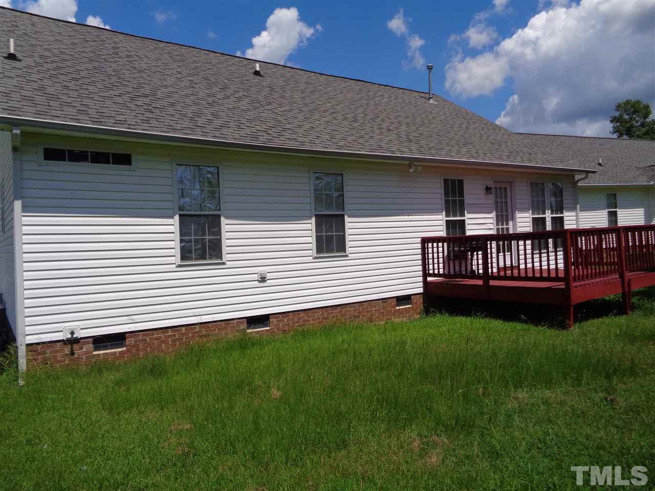 7124 Spanglers Spring Way Raleigh, NC 27610 - Photo 10 of 10 a view of a house with a backyard