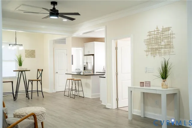 a view of kitchen with table chairs refrigerator and sink