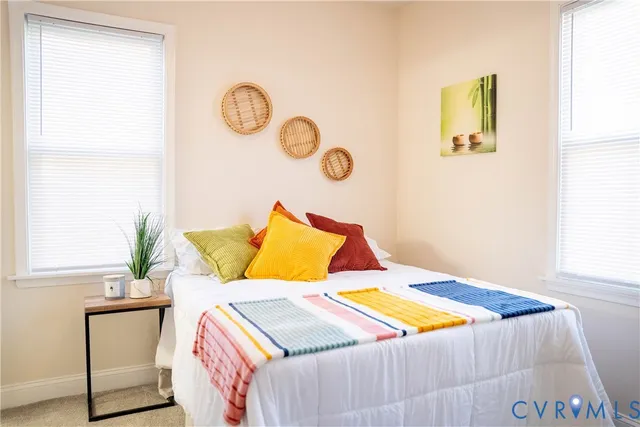 a bedroom with a bed and a window in it