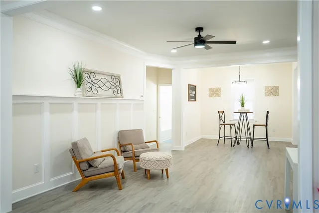 a dining room with furniture and wooden floor
