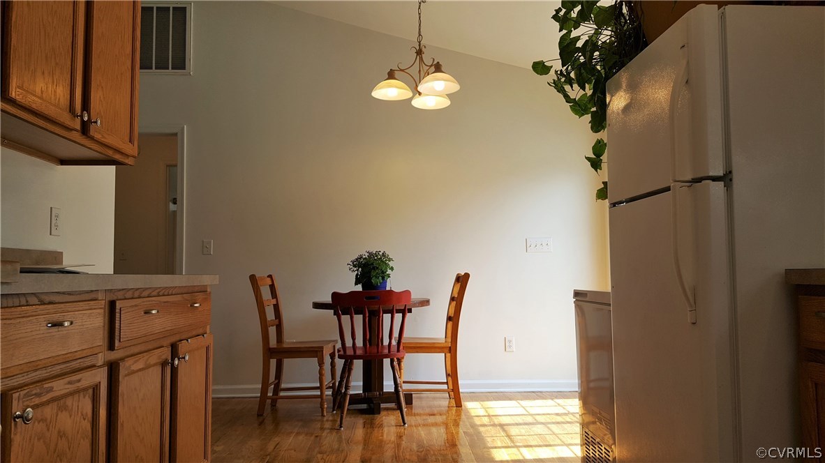 4810 Venable Road Kents Store, VA 23084 - Photo 11 of 22 a dining room with furniture and wooden floor