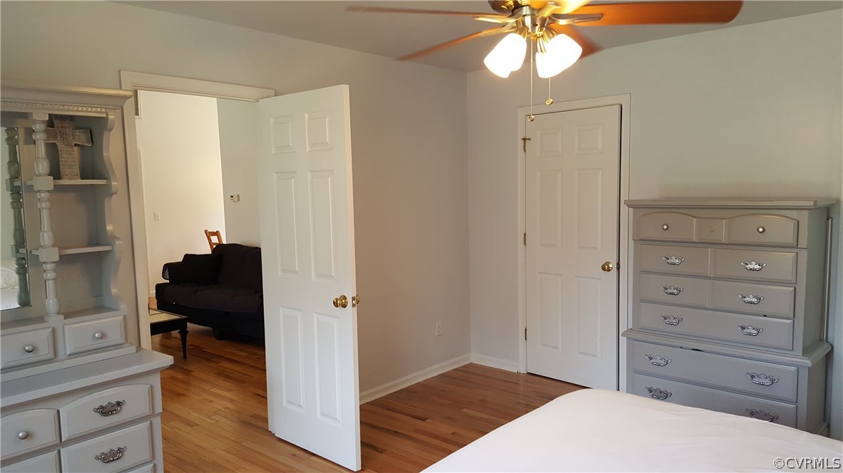 4810 Venable Road Kents Store, VA 23084 - Photo 12 of 22 a bedroom with a bed and a chandelier