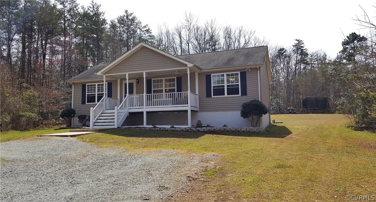 4810 Venable Road Kents Store, VA 23084 - Photo 2 of 22 a front view of house with yard and trees in the background