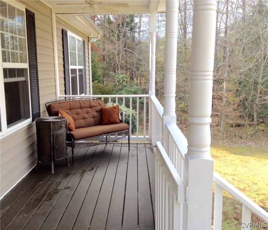 4810 Venable Road Kents Store, VA 23084 - Photo 3 of 22 a balcony with wooden floor and outdoor seating