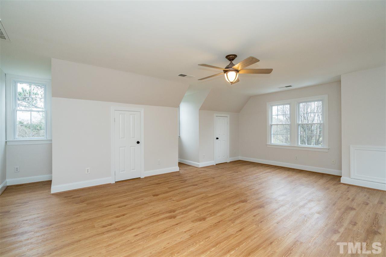 6916 Darcy Lane Raleigh, NC 27606 - Photo 21 of 30 Large bonus room plumbed for a wet bar, with separate stairs.