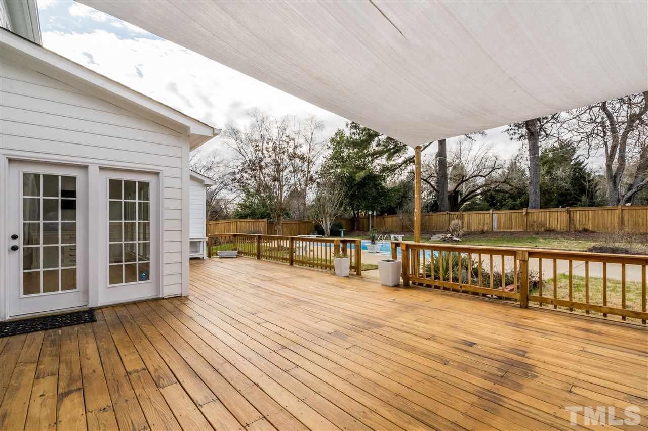 6916 Darcy Lane Raleigh, NC 27606 - Photo 23 of 30 Huge deck overlooks your own private pool.