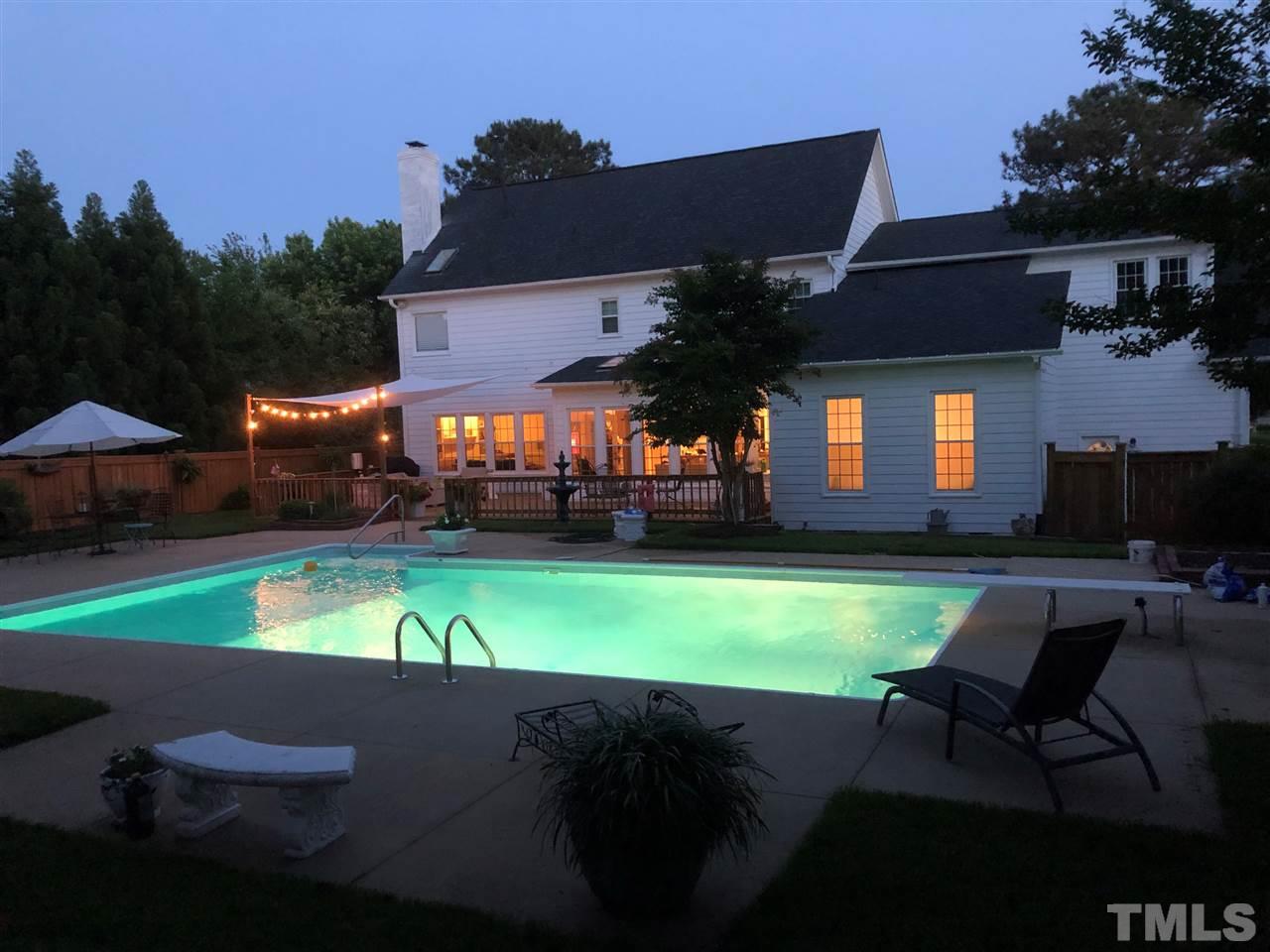 6916 Darcy Lane Raleigh, NC 27606 - Photo 30 of 30 Sellers photo of an evening by the pool in Summer.