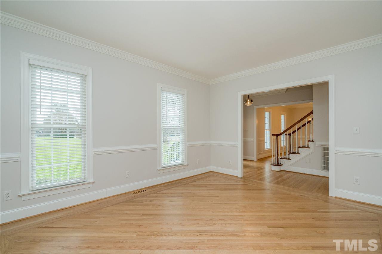 6916 Darcy Lane Raleigh, NC 27606 - Photo 4 of 30 Formal living would make a great office. Doors would be easy to add.