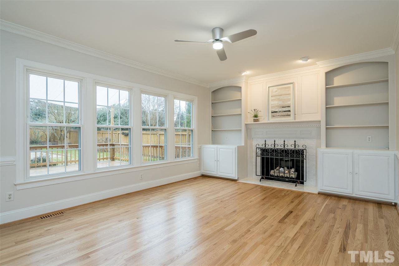 6916 Darcy Lane Raleigh, NC 27606 - Photo 5 of 30 Family room with built in bookcases and gas fireplace.