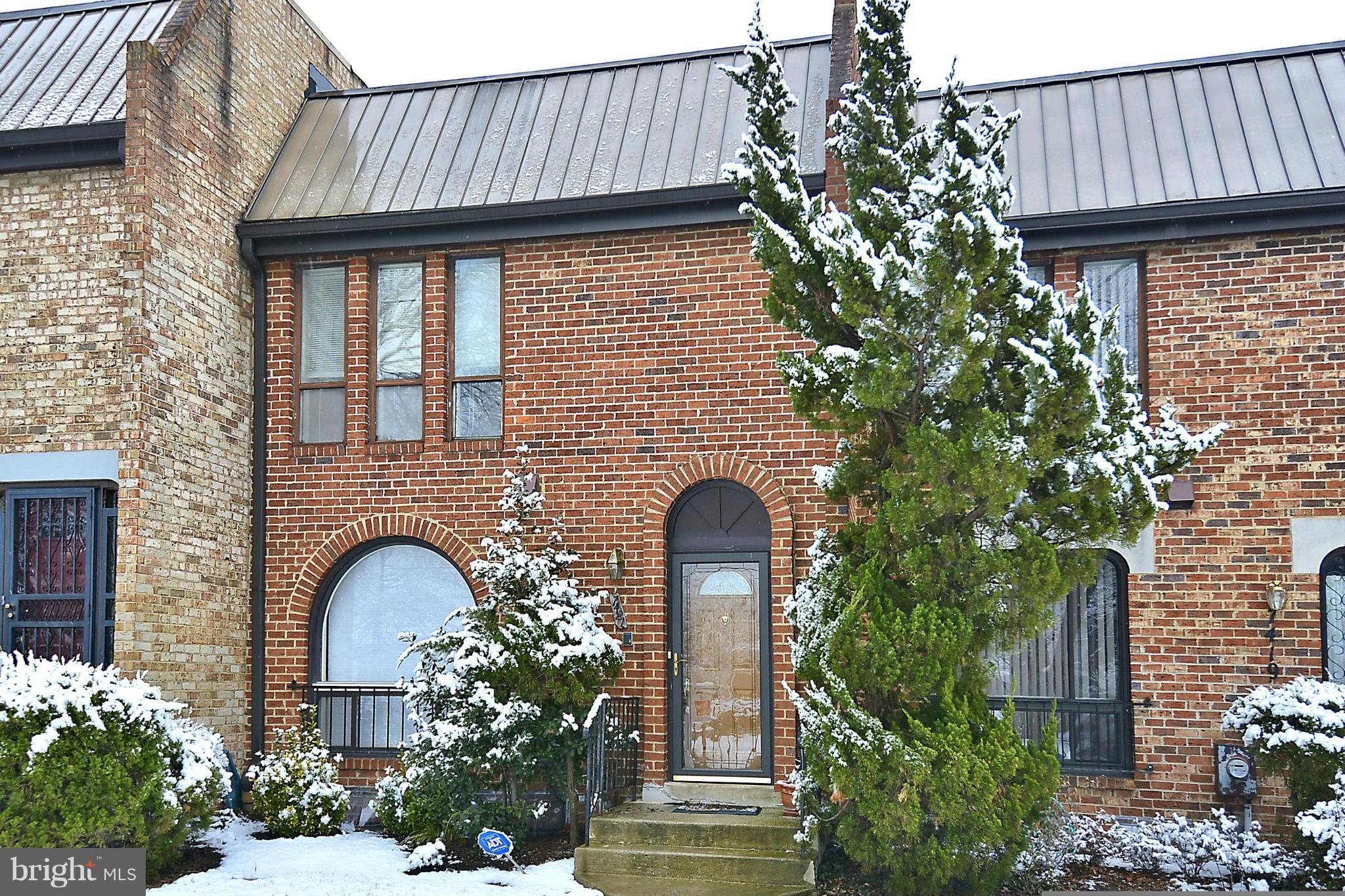 7421 Blair Road Northwest, Unit 7421 Washington, DC 20012 - Photo 1 of 27 a front view of a house with plants