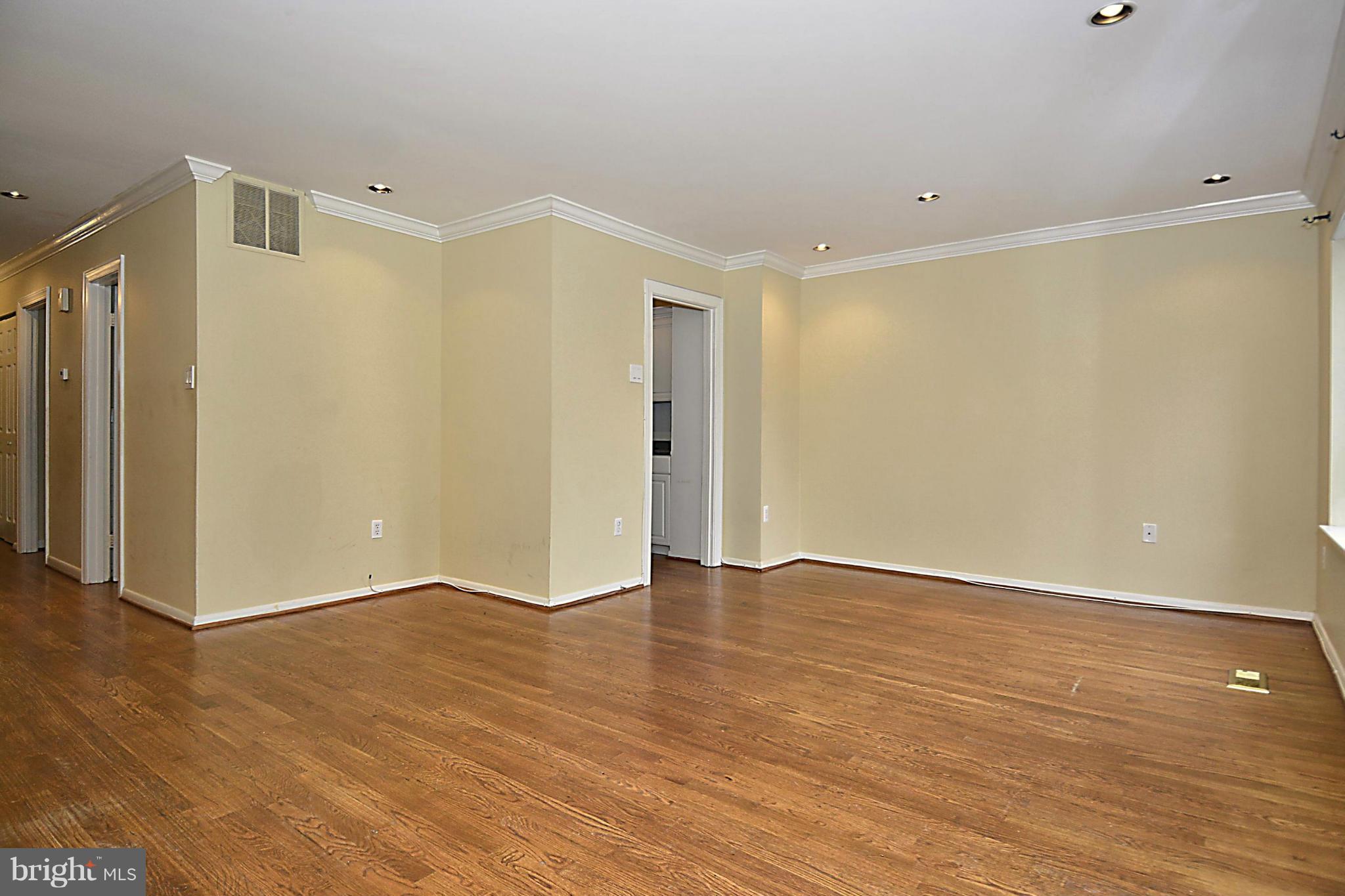 7421 Blair Road Northwest, Unit 7421 Washington, DC 20012 - Photo 13 of 27 a view of an empty room with wooden floor