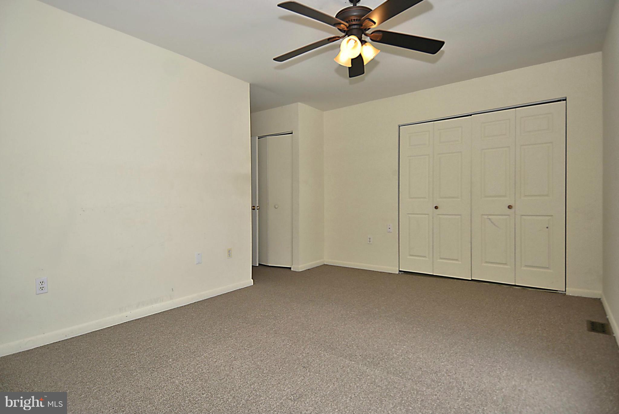 7421 Blair Road Northwest, Unit 7421 Washington, DC 20012 - Photo 16 of 27 an empty room with a fan and a fan