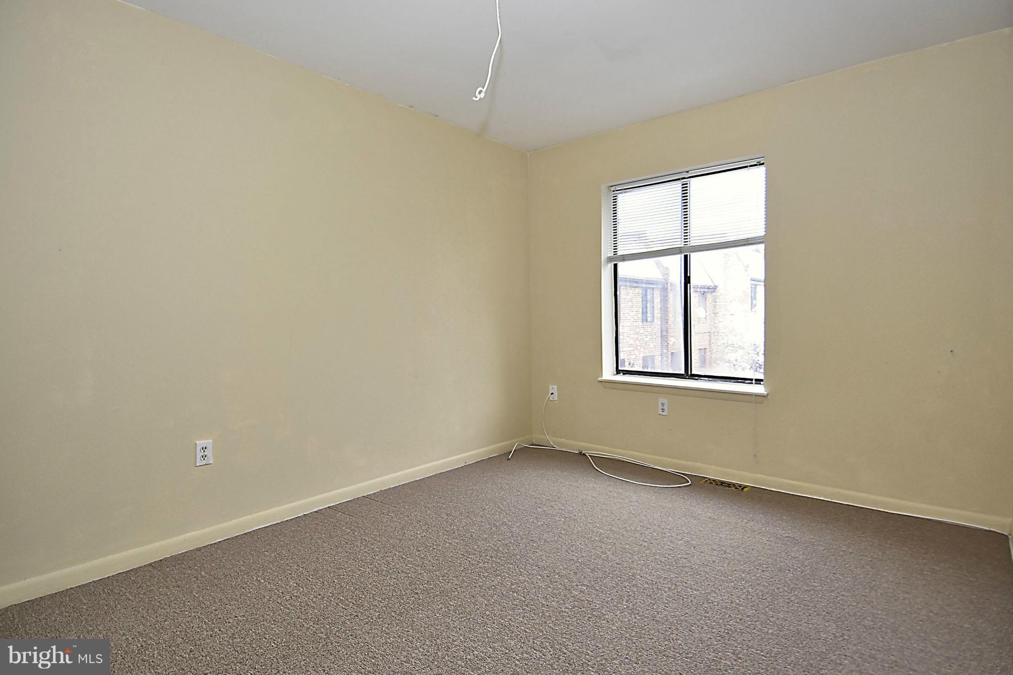 7421 Blair Road Northwest, Unit 7421 Washington, DC 20012 - Photo 19 of 27 an empty room with a window