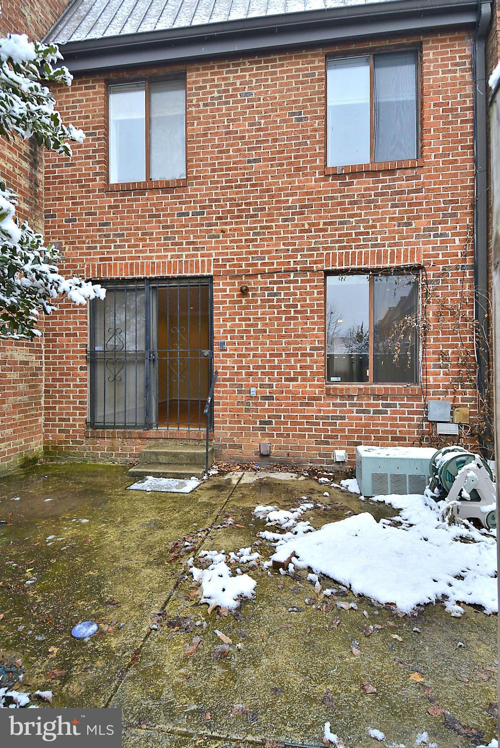 7421 Blair Road Northwest, Unit 7421 Washington, DC 20012 - Photo 3 of 27 a front view of a house with a yard