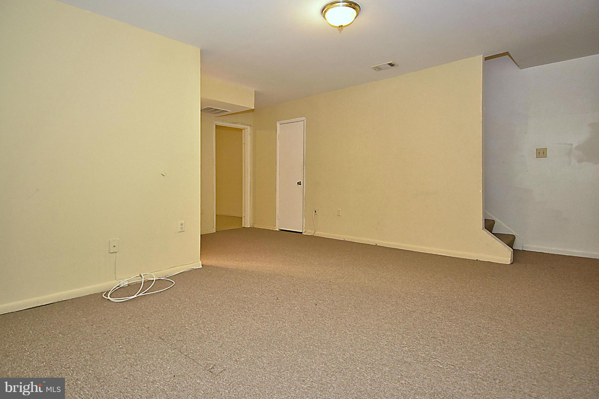 7421 Blair Road Northwest, Unit 7421 Washington, DC 20012 - Photo 22 of 27 an empty room with a door