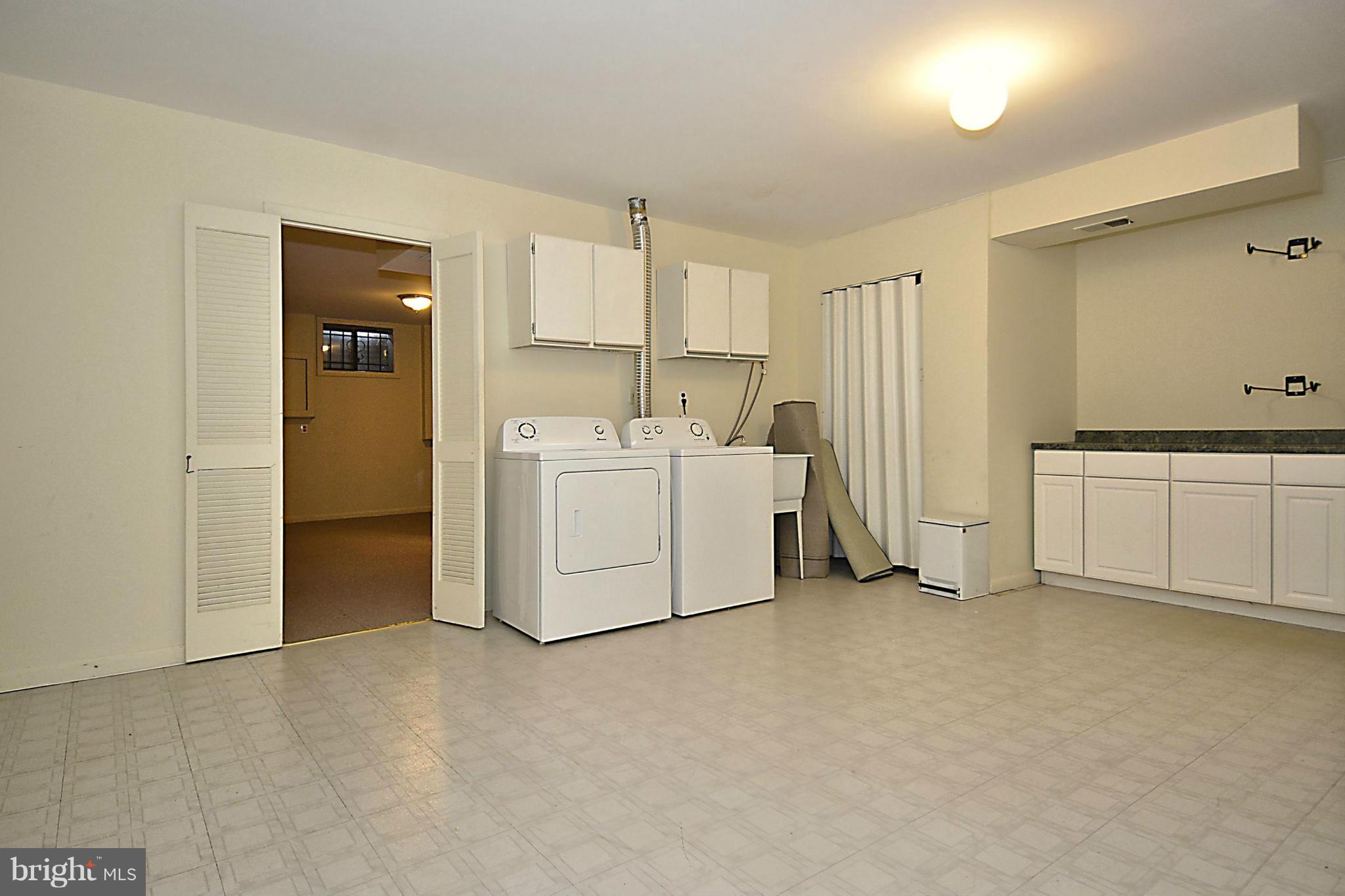 7421 Blair Road Northwest, Unit 7421 Washington, DC 20012 - Photo 26 of 27 a room with a bed and cabinets