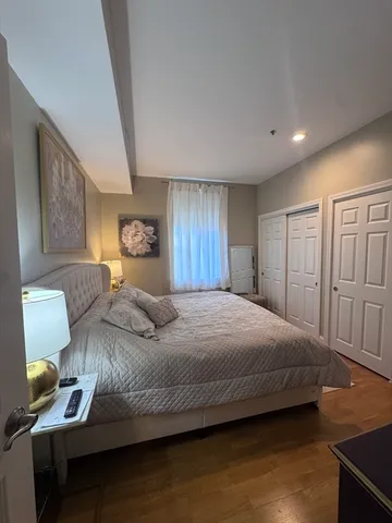 a bathroom with a granite countertop sink toilet and shower curtain