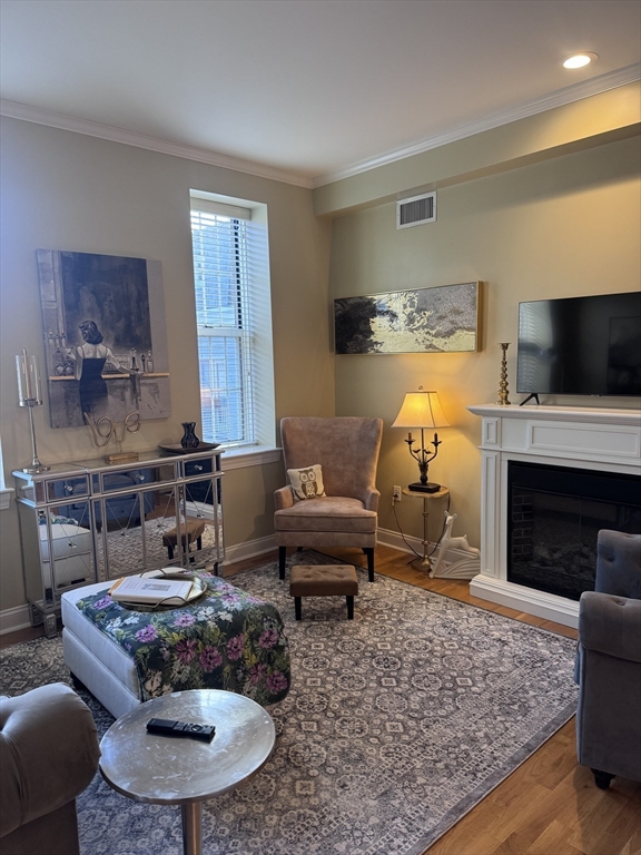 17 Central Street, Unit 9 Salem, MA 01970 - Photo 3 of 13 a living room with furniture and a fireplace