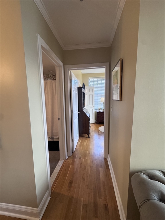17 Central Street, Unit 9 Salem, MA 01970 - Photo 4 of 13 a view of a hallway view with wooden floor and staircase