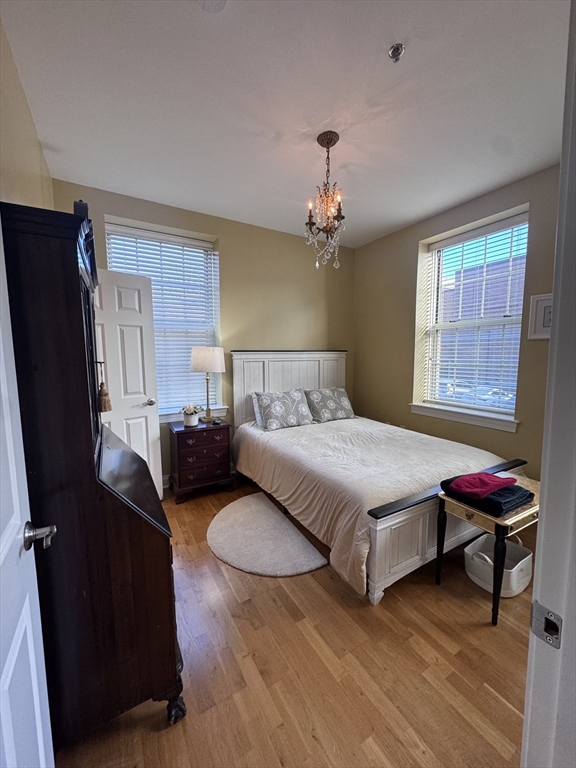 17 Central Street, Unit 9 Salem, MA 01970 - Photo 6 of 13 a bedroom with a bed dresser and a window