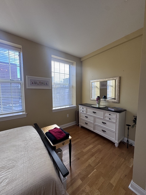 17 Central Street, Unit 9 Salem, MA 01970 - Photo 7 of 13 a bedroom with furniture and window