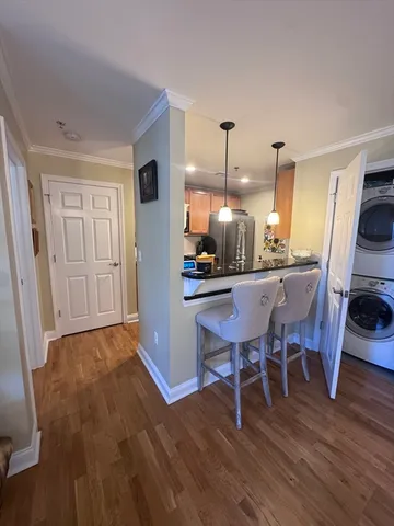 a view of a storage and utility room with washer and dryer