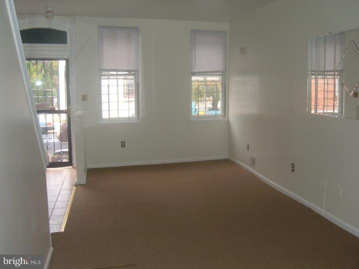 3936 Spring Garden Street Philadelphia, PA 19104 - Photo 3 of 7 an empty room with windows