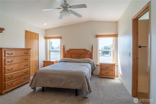 a bedroom with a bed and a dresser