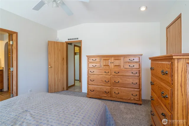 a bedroom with a bed and a closet