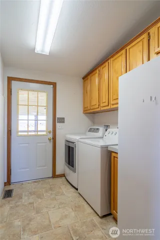 a living room with furniture a dining table and chairs