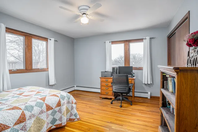 a bedroom with furniture and a window