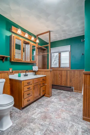 a room with mirror and window