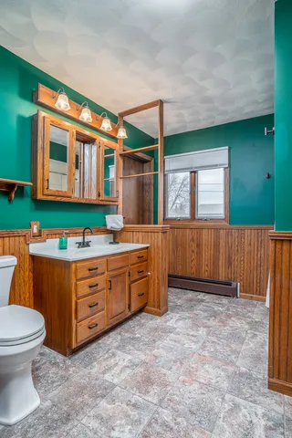 a room with mirror and window