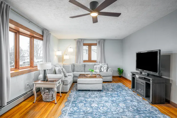 a living room with furniture and a flat screen tv