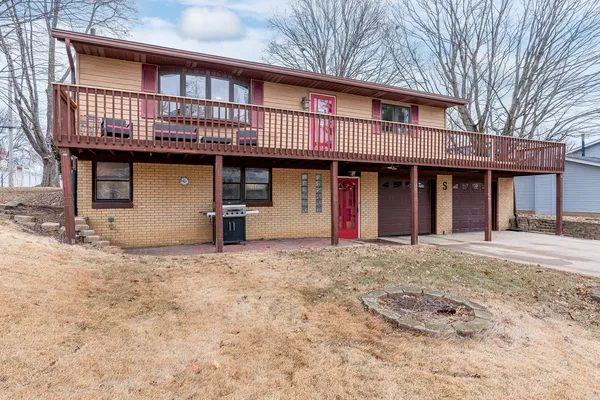 a front view of a house with garage