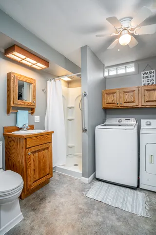 a bathroom with a toilet a sink and a bathtub