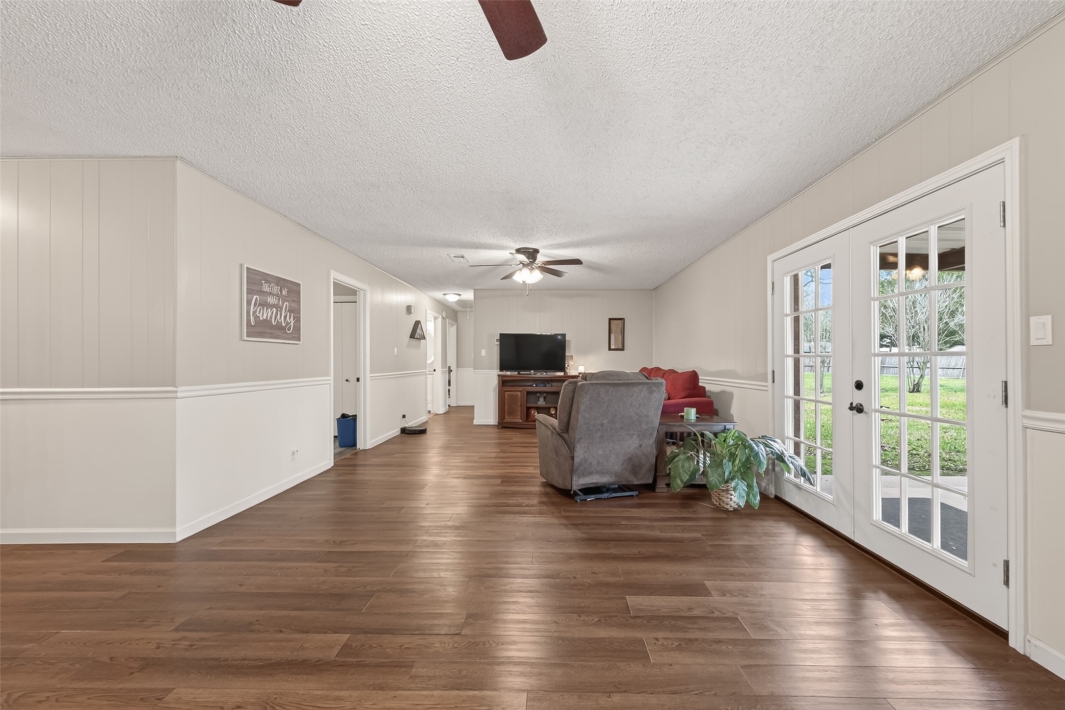 9525 Gene Street Needville, TX 77461 - Photo 11 of 48 a living room with furniture wooden floor and a fireplace