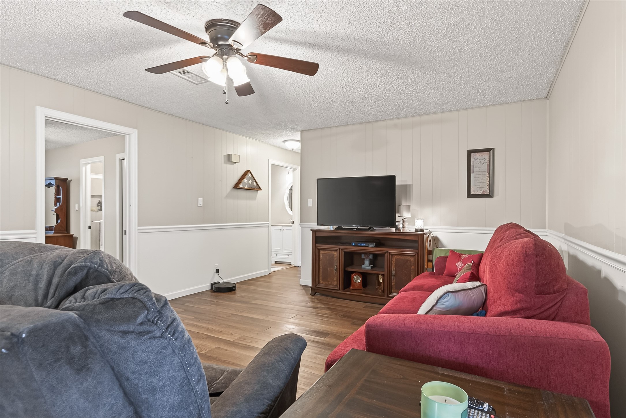 9525 Gene Street Needville, TX 77461 - Photo 12 of 48 a living room with furniture and a flat screen tv