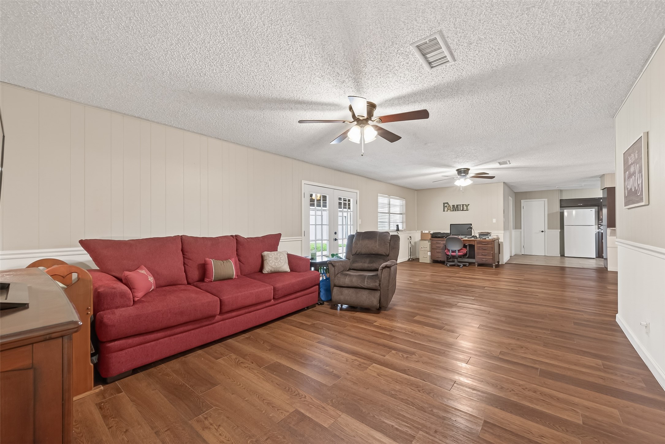 9525 Gene Street Needville, TX 77461 - Photo 13 of 48 a living room with furniture and a wooden floor