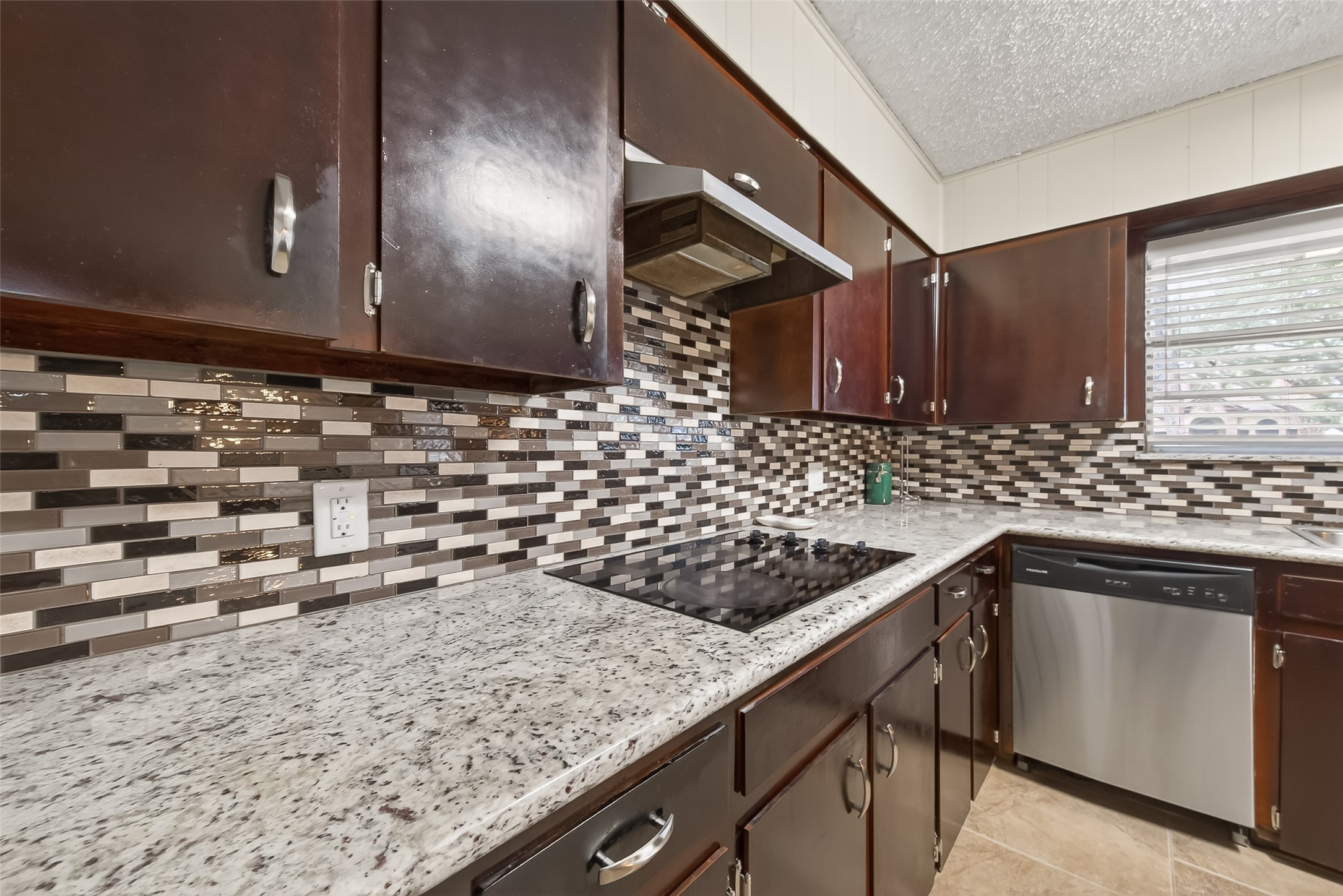 9525 Gene Street Needville, TX 77461 - Photo 19 of 48 a kitchen with a sink and cabinets