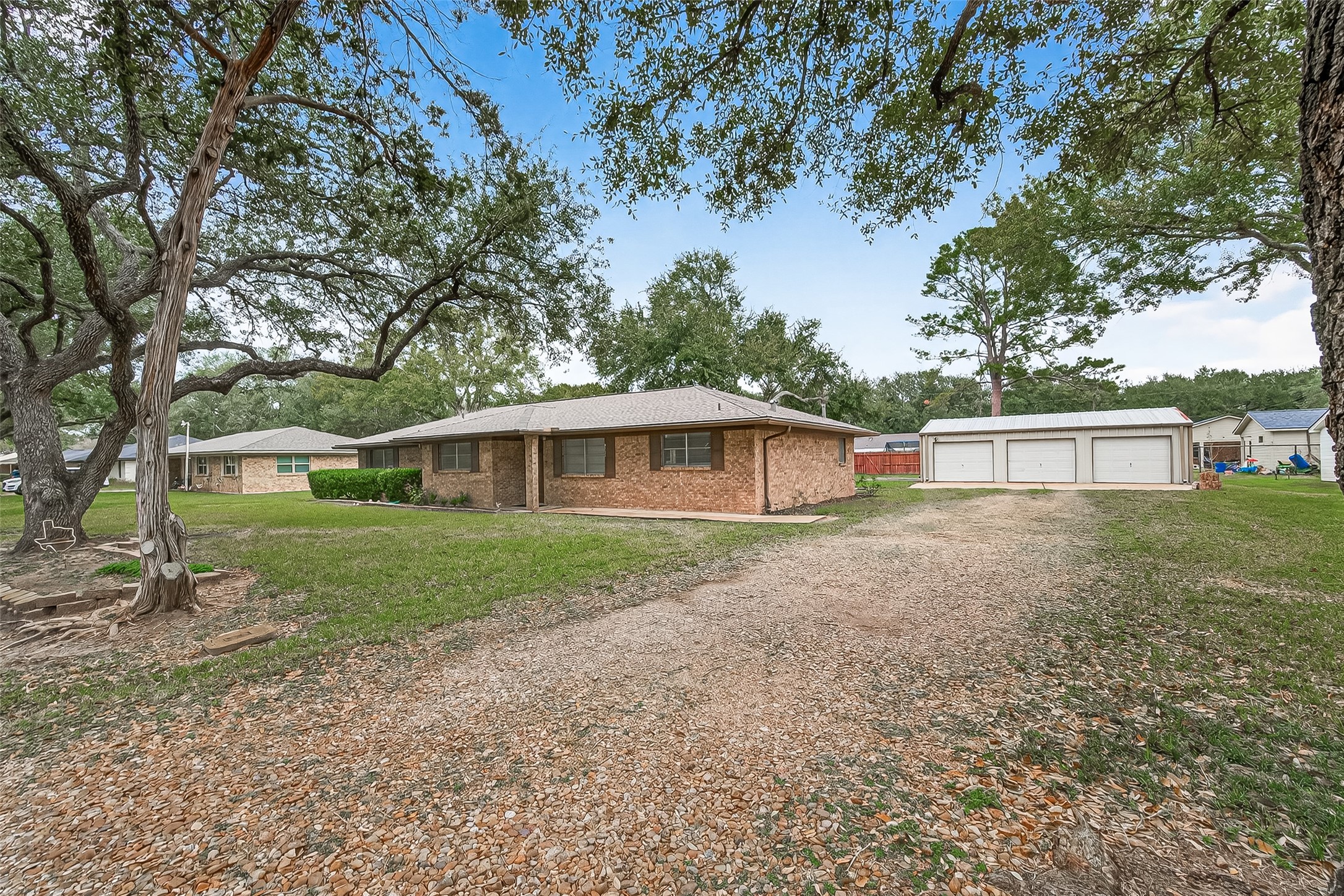 9525 Gene Street Needville, TX 77461 - Photo 2 of 48 a view of a house with a yard