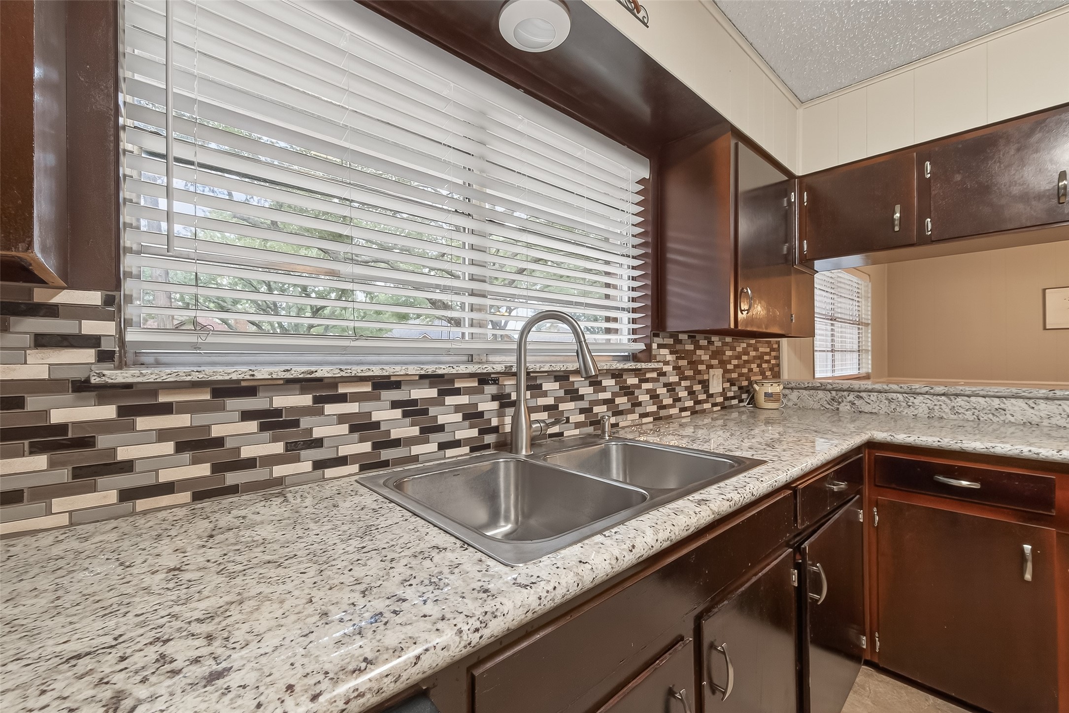 9525 Gene Street Needville, TX 77461 - Photo 22 of 48 a kitchen with a sink and cabinets