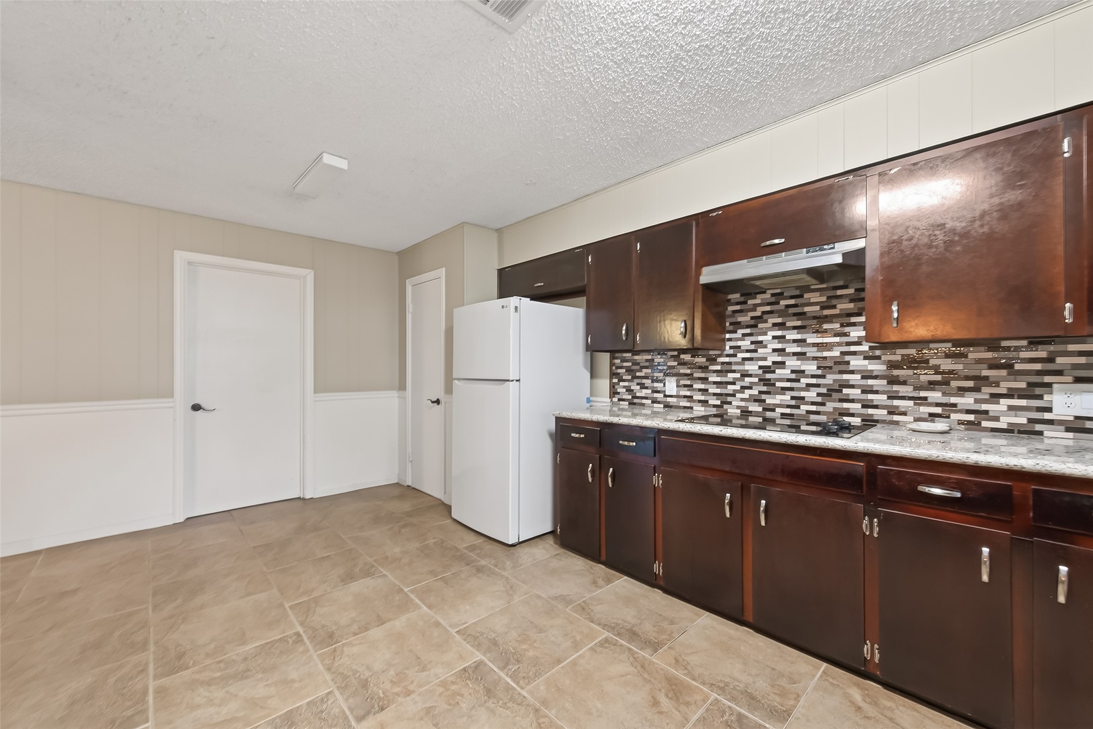 9525 Gene Street Needville, TX 77461 - Photo 23 of 48 a view of kitchen with refrigerator sink and wooden floor