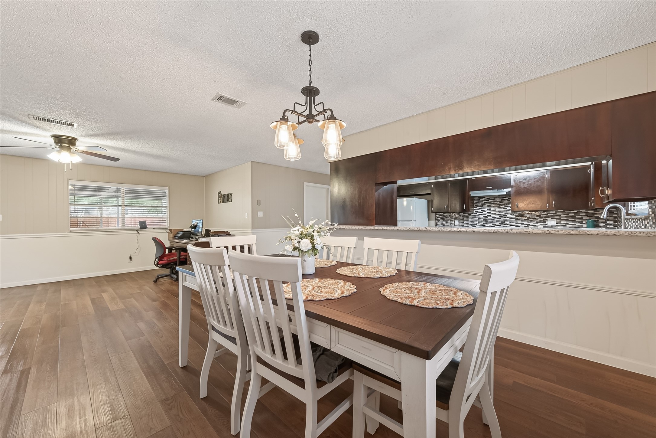 9525 Gene Street Needville, TX 77461 - Photo 26 of 48 a view of a a dining room with furniture window and wooden floor